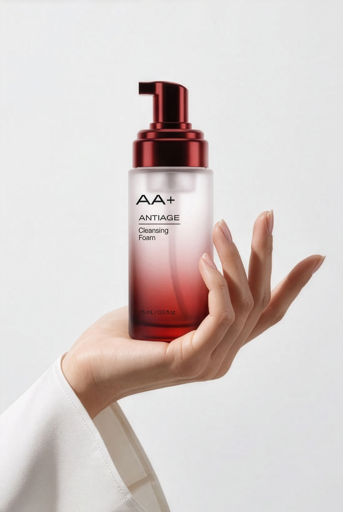AA+ antiage cleansing foam bottle held in hand