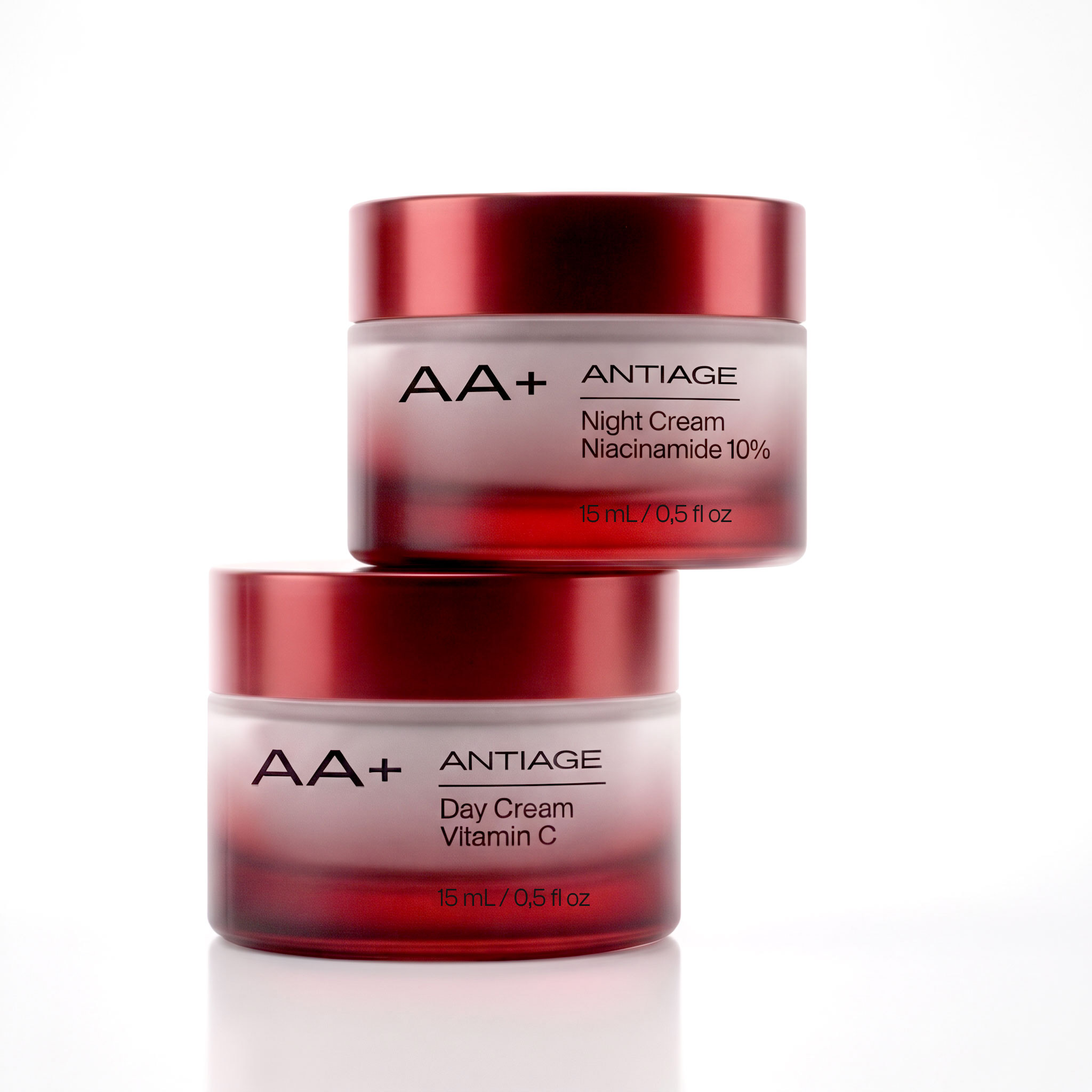 AA+ antiage night cream and day cream jars stacked